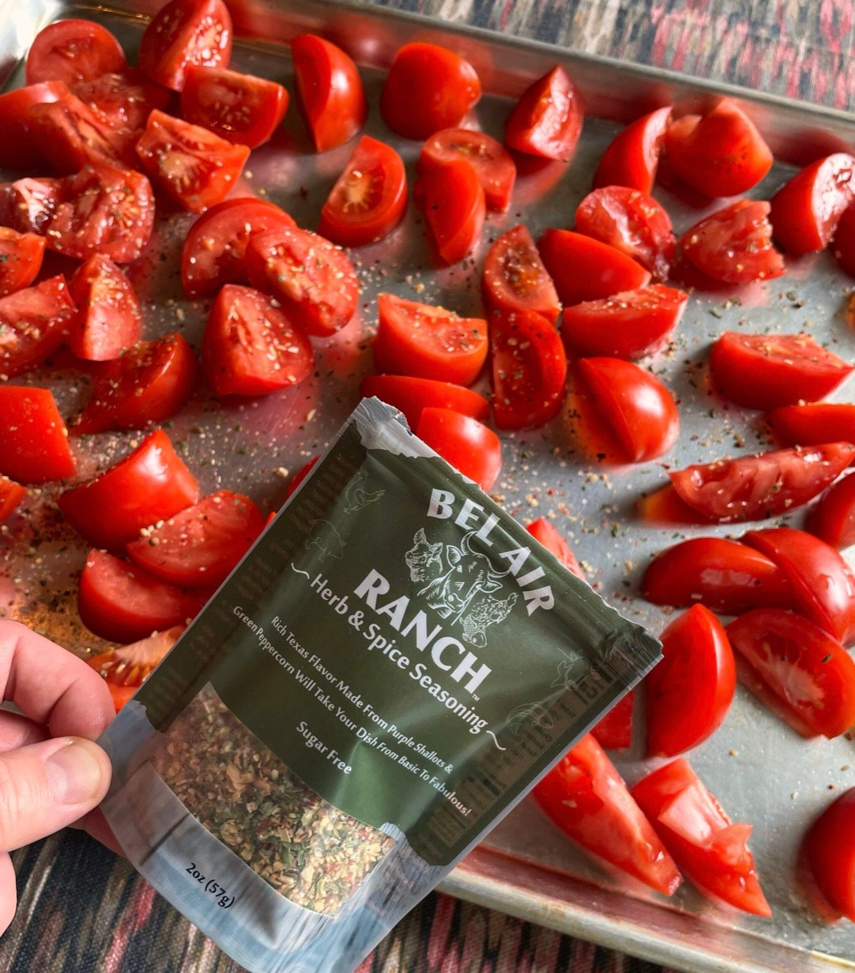 Seasoned tomatoes on a sheet pan